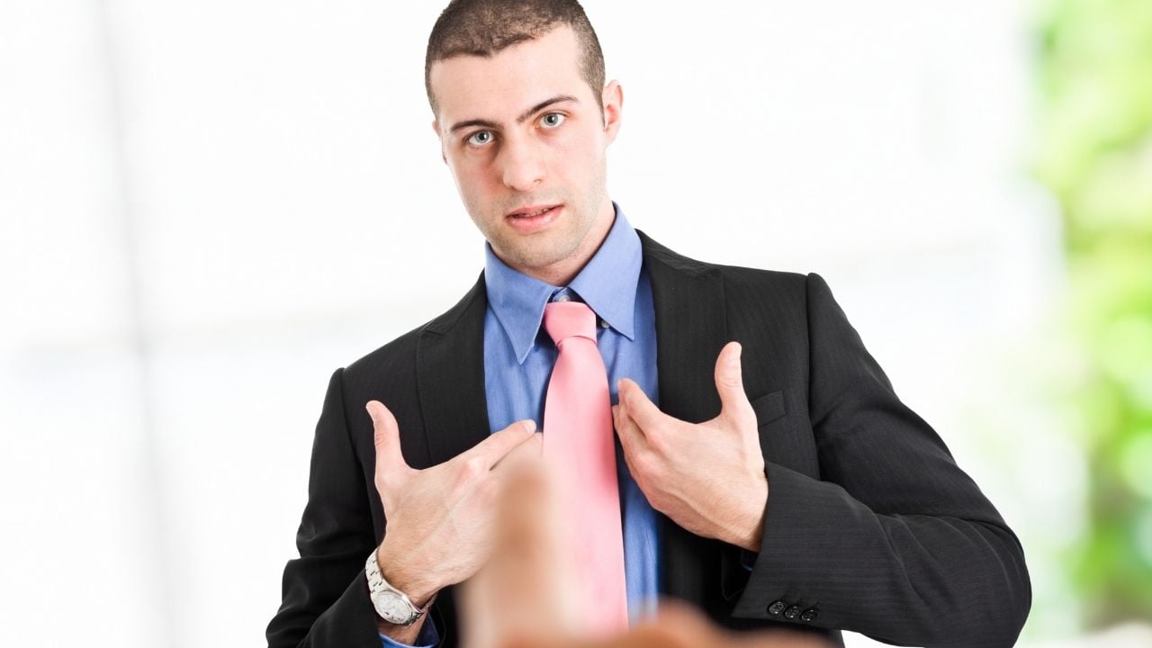 a finger pointing at a person